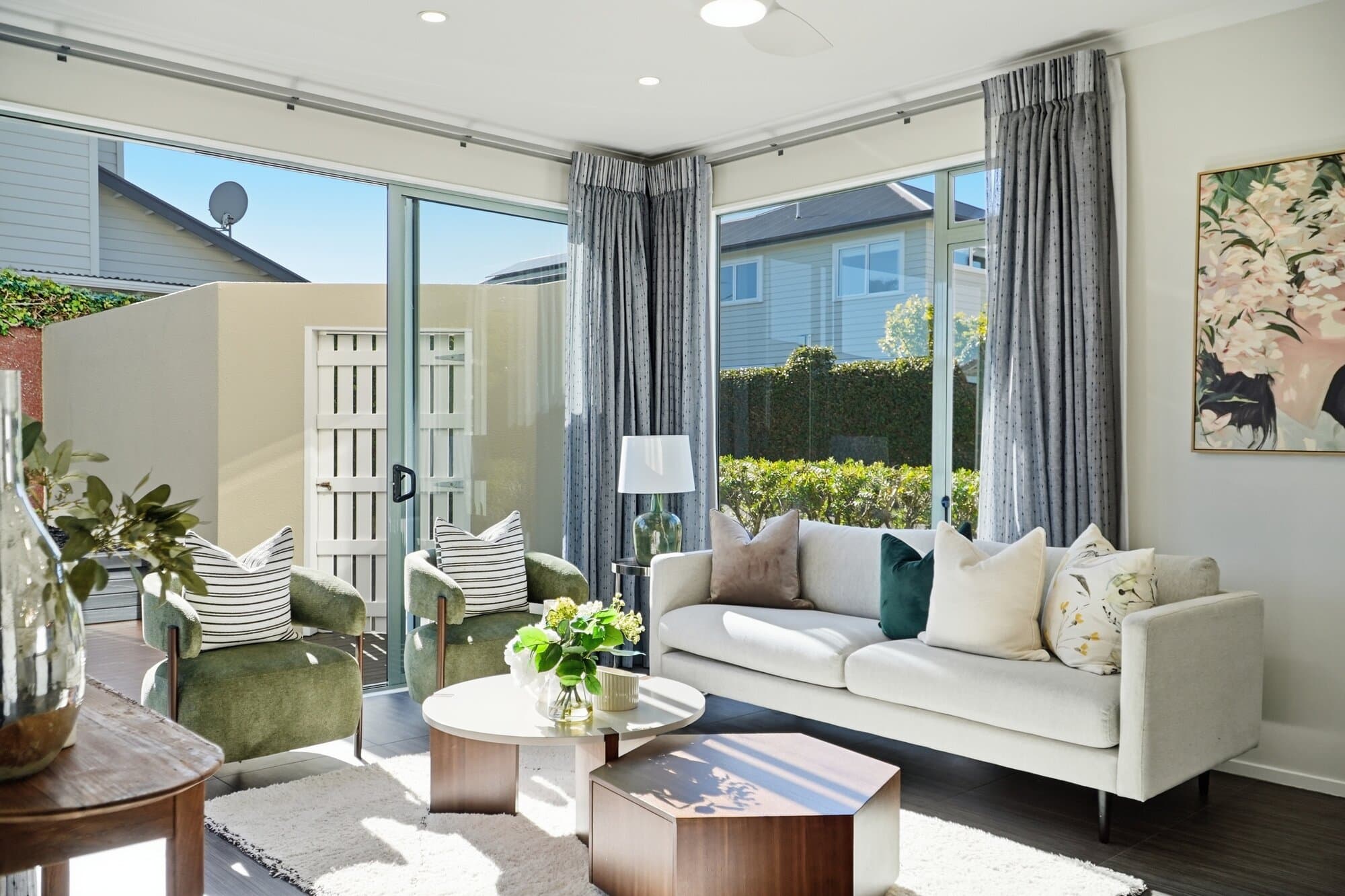 Sunlit living room with glass doors to the garden