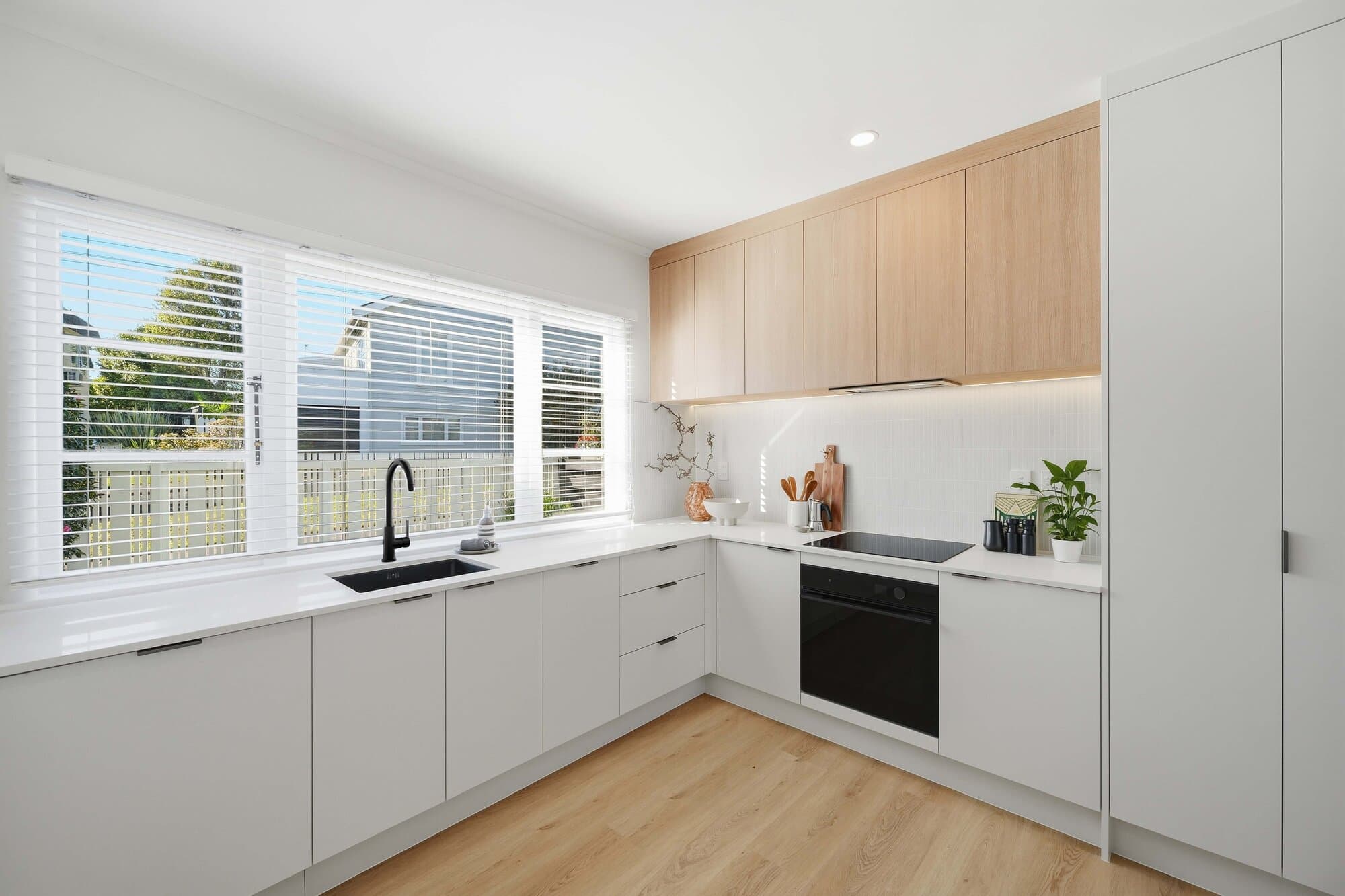 Kitchen with timber upper cabinets