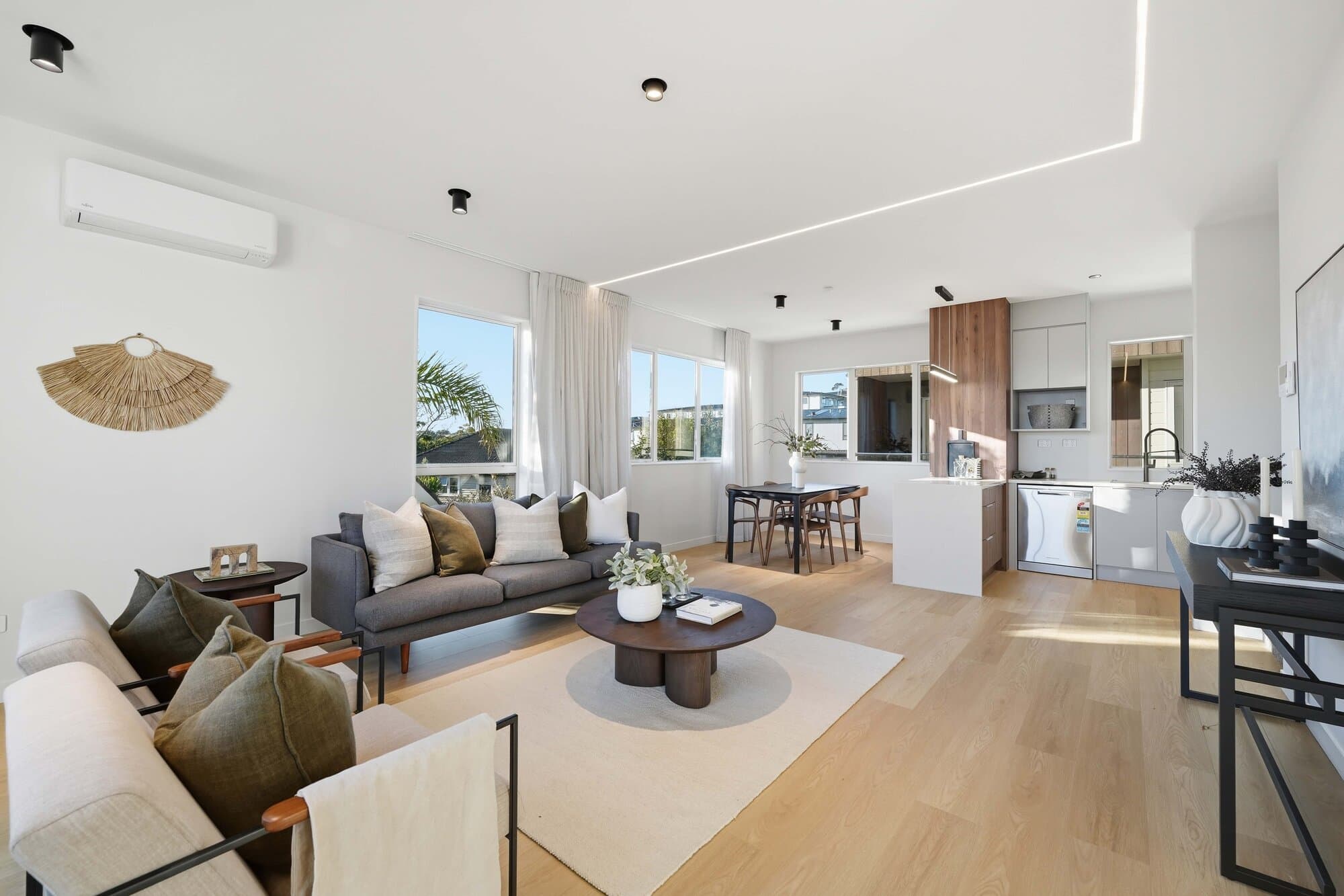 Living room with harbour views through full-height windows