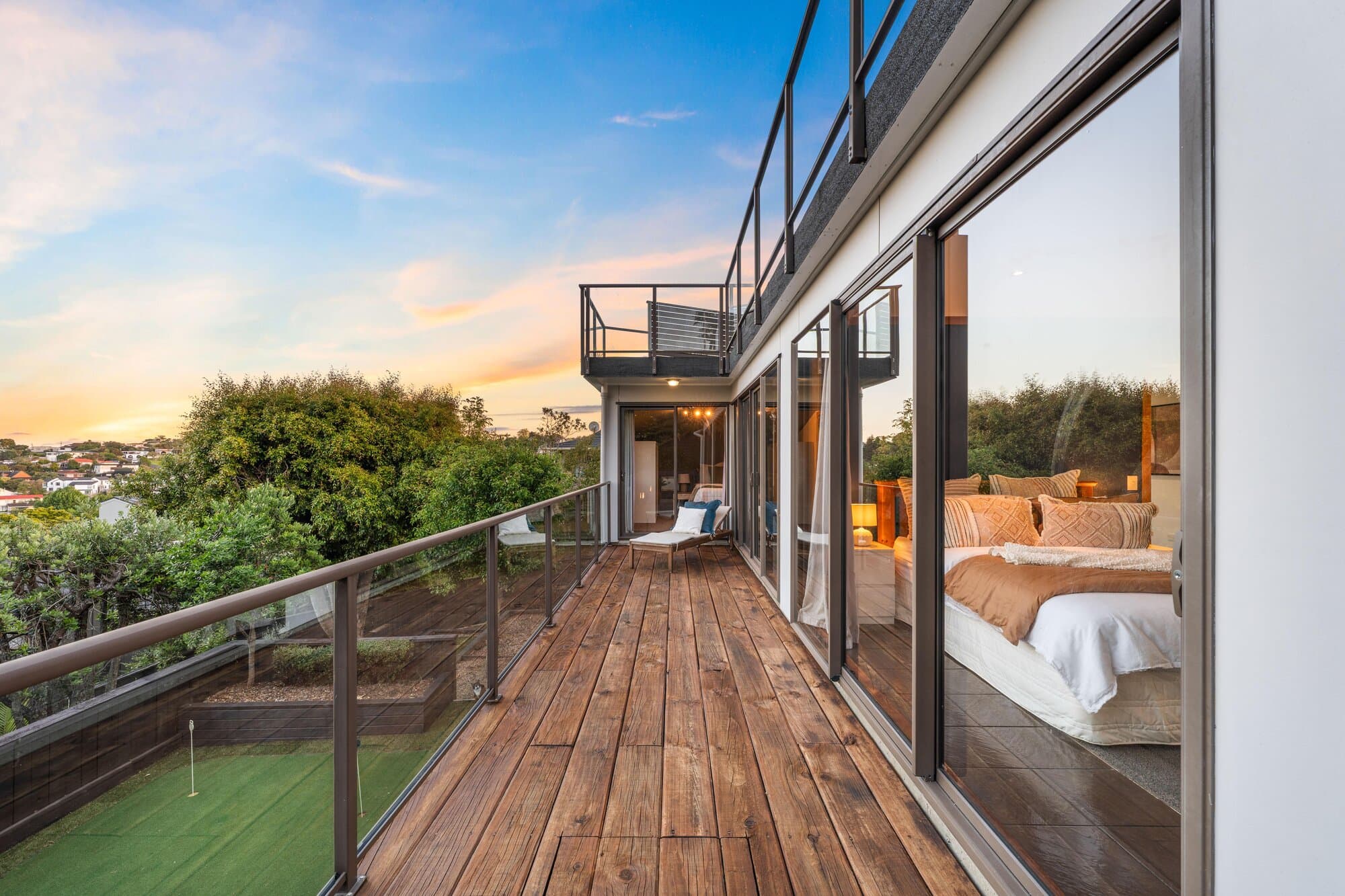 Deck at twilight overlooking the backyard putting green