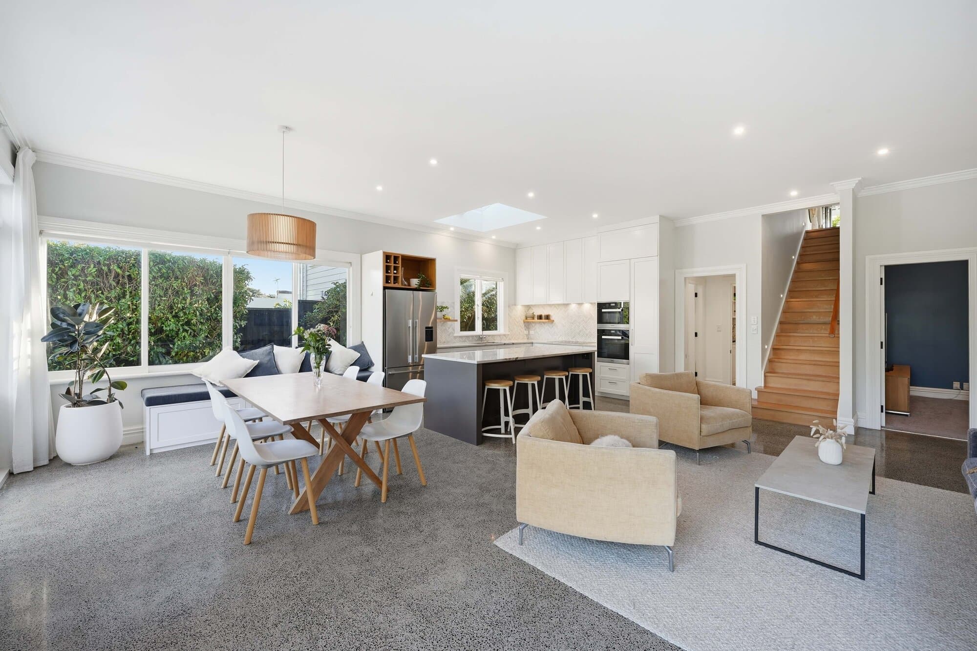 Wide angle of the kitchen, dining, and living space