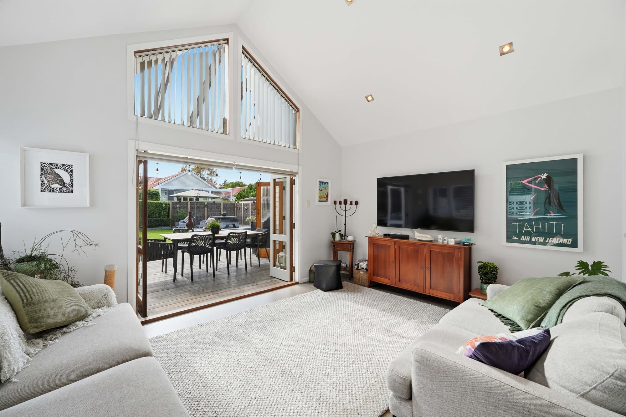 Living room beneath a vaulted ceiling